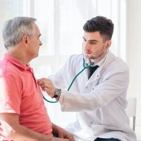 Senior man being examined by a doctor