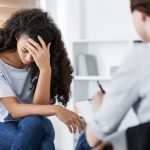 Professional psychotherapies and young woman suffering from mental injury